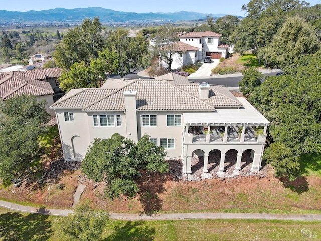 drone / aerial view featuring a mountain view