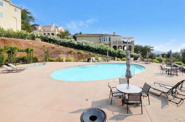 community pool featuring a patio area