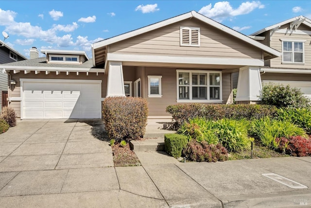 craftsman inspired home with a garage and concrete driveway