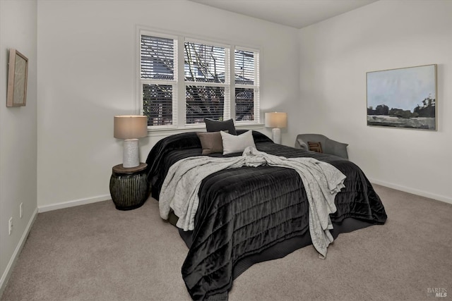 carpeted bedroom with baseboards