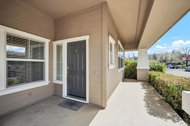 doorway to property featuring a porch