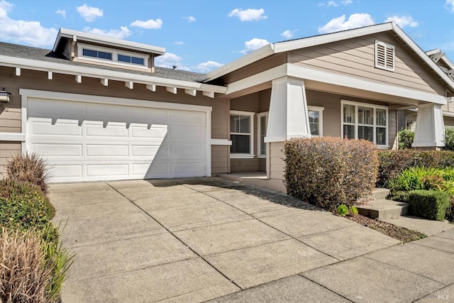 view of front of home featuring a garage and driveway