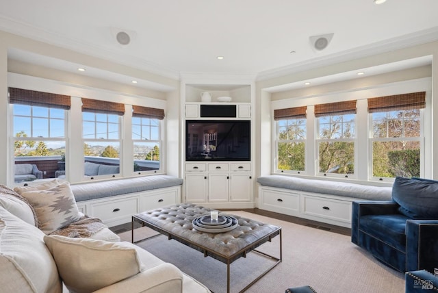 living area featuring light wood-style floors, crown molding, recessed lighting, and visible vents