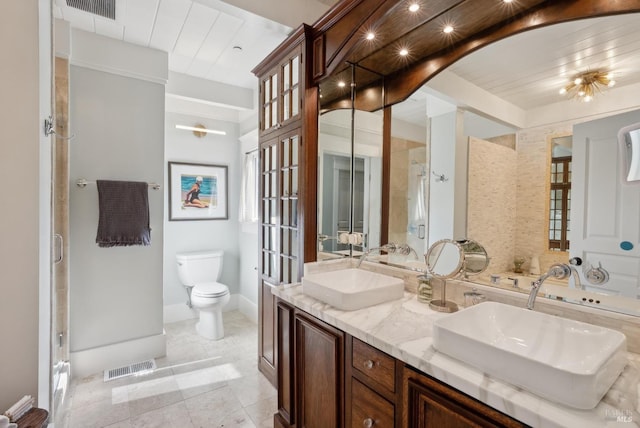 full bathroom with a shower stall, toilet, visible vents, and a sink