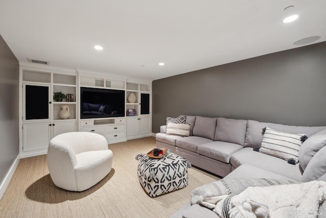 living area with visible vents, recessed lighting, and baseboards