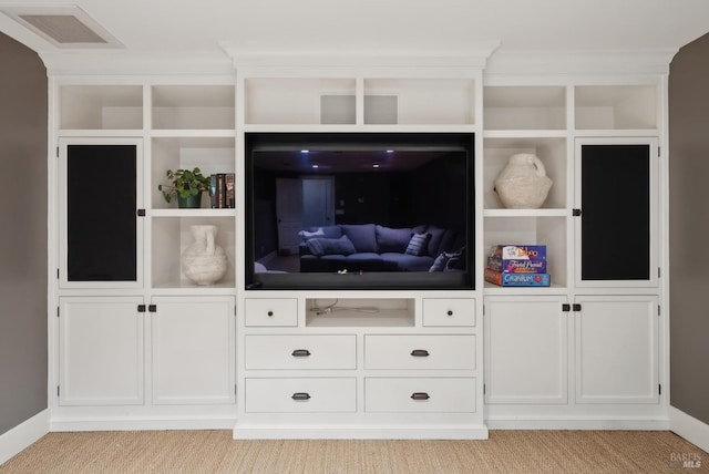 unfurnished living room featuring visible vents