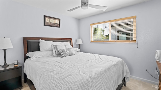 bedroom featuring ceiling fan, baseboards, and carpet