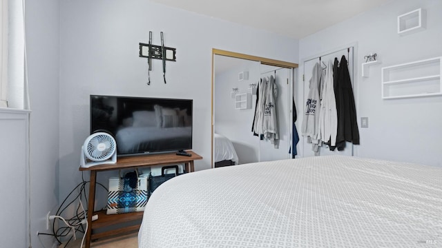 bedroom featuring a closet and visible vents