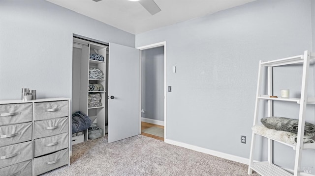bedroom with carpet, a closet, a ceiling fan, and baseboards