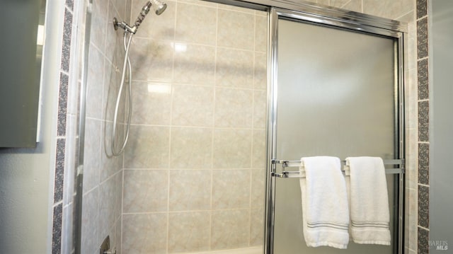 bathroom with a shower stall