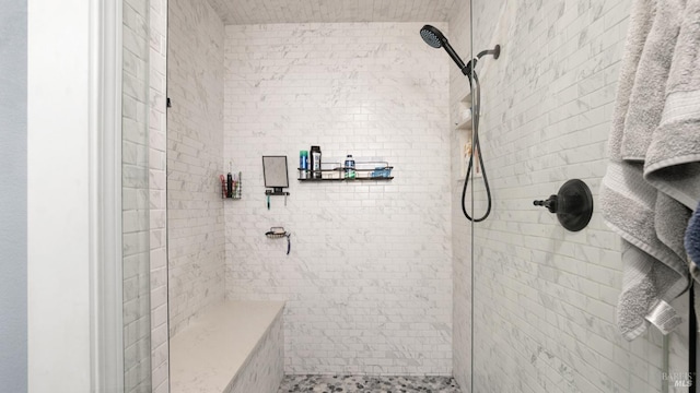 full bath featuring tiled shower