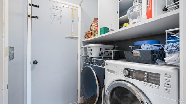 laundry area featuring washer and dryer and laundry area