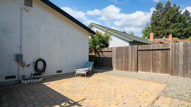 view of patio featuring fence