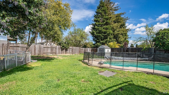 view of yard featuring a fenced in pool and a fenced backyard