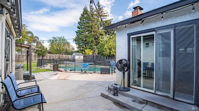 view of patio featuring a fenced in pool and a fenced backyard