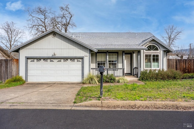 ranch-style house with covered porch, concrete driveway, a garage, and fence