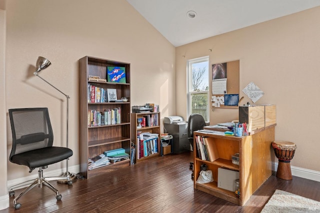 office space with baseboards, lofted ceiling, and wood finished floors