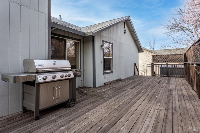 wooden deck featuring area for grilling