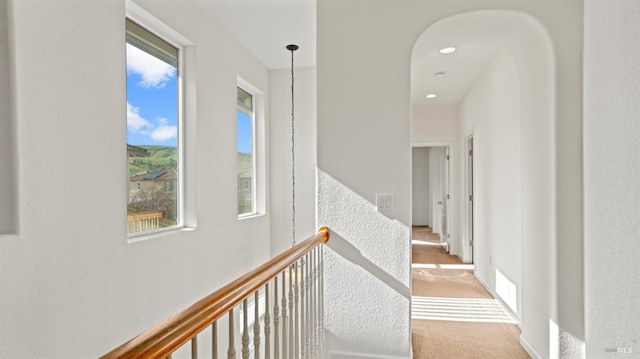 hall with visible vents, recessed lighting, and carpet