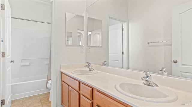 full bath featuring double vanity, toilet, shower / tub combo, and a sink