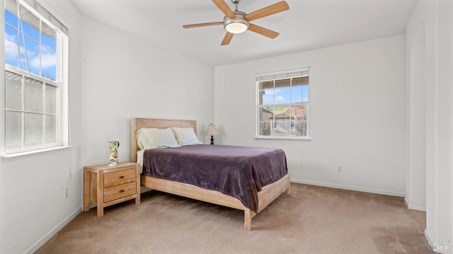 bedroom featuring carpet flooring, baseboards, and ceiling fan