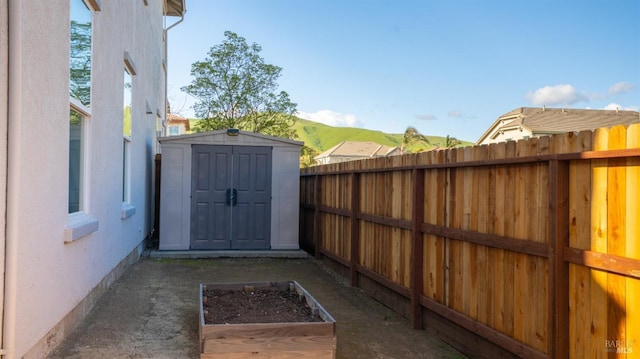 view of shed featuring a fenced backyard