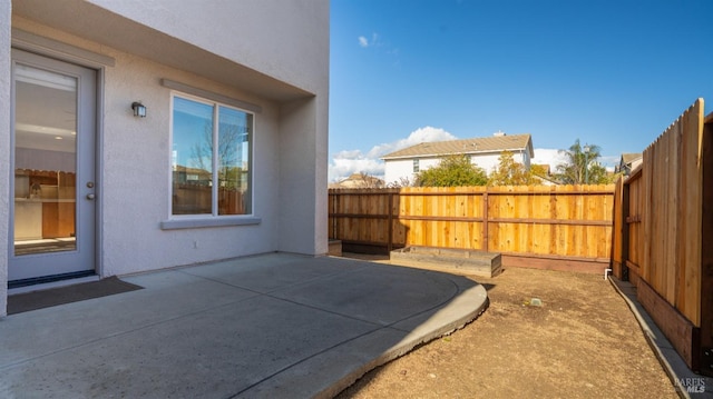 view of patio with fence