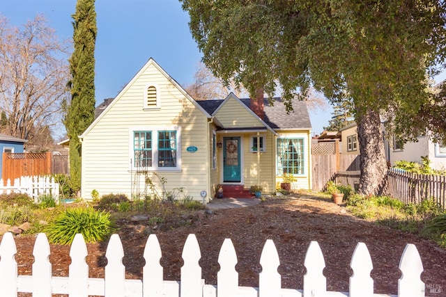 view of front of home featuring entry steps and fence