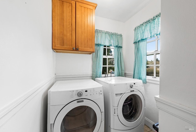 laundry room featuring cabinet space and independent washer and dryer