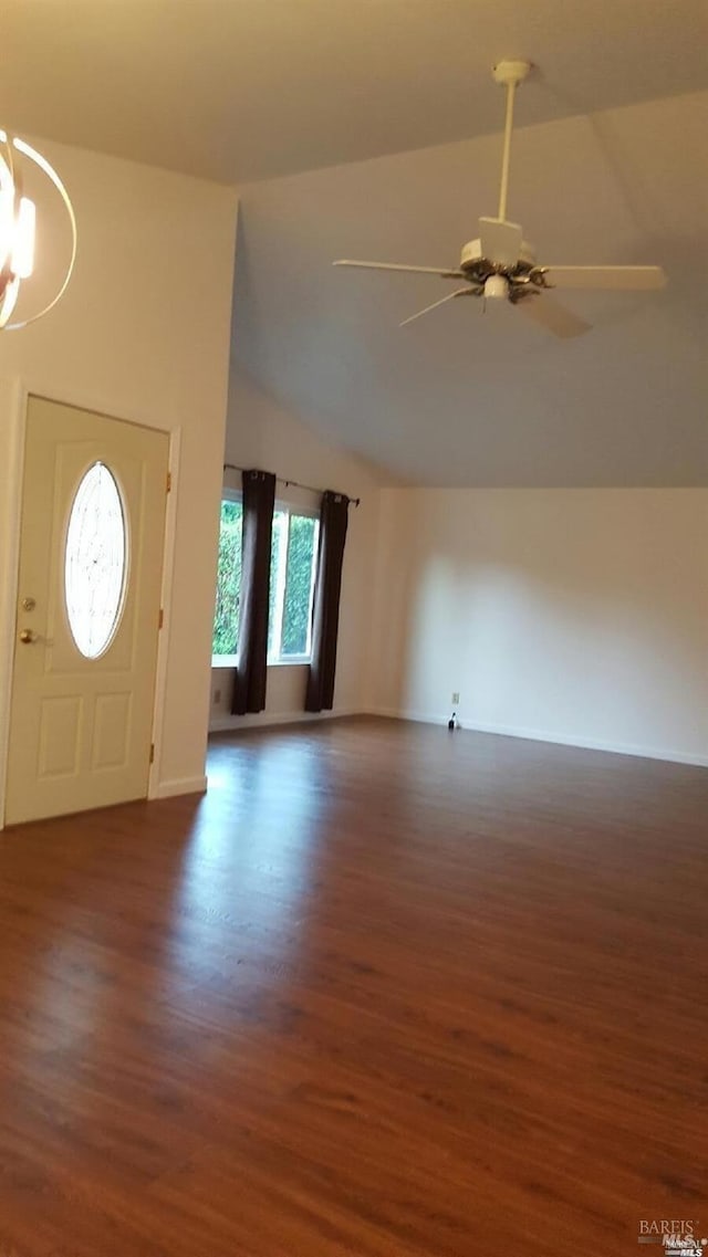 entrance foyer featuring wood finished floors, ceiling fan with notable chandelier, baseboards, and high vaulted ceiling