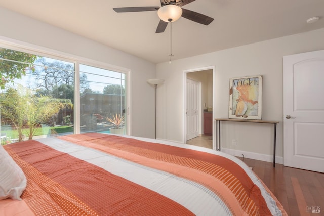 bedroom with ceiling fan, baseboards, and wood finished floors