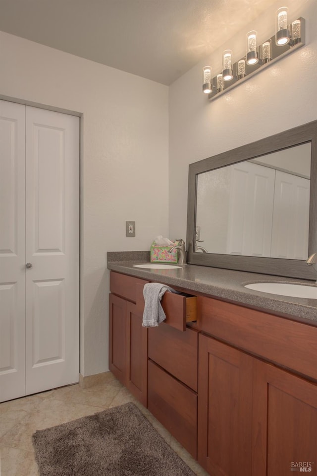 bathroom with vanity and tile patterned flooring