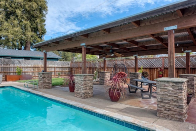 view of pool with a patio, a fenced in pool, and fence