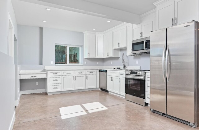 kitchen with finished concrete flooring, white cabinetry, recessed lighting, appliances with stainless steel finishes, and baseboards