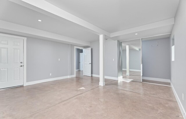 finished below grade area featuring recessed lighting and baseboards