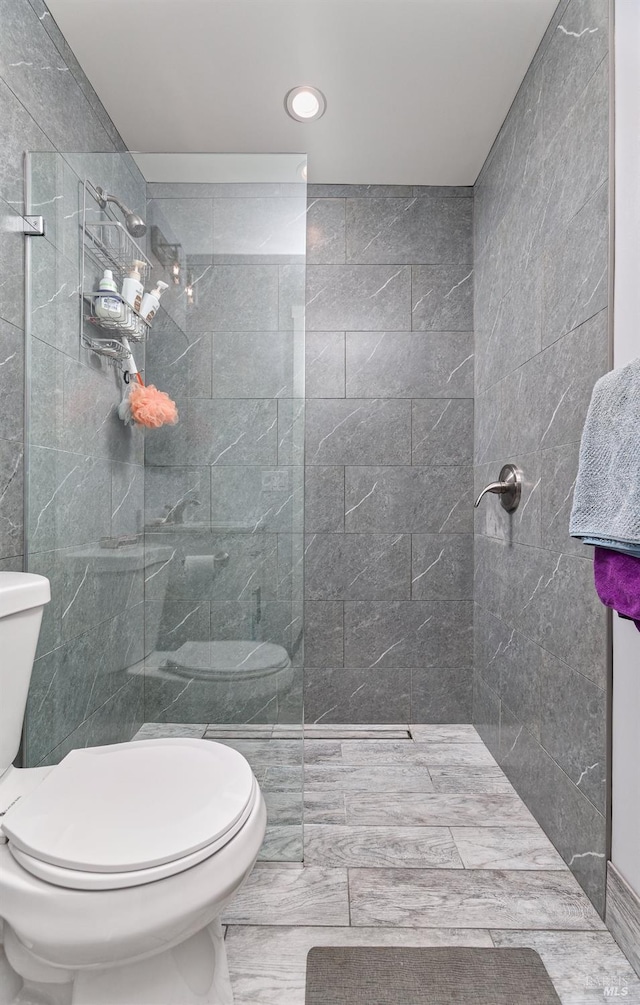 full bathroom featuring toilet and walk in shower