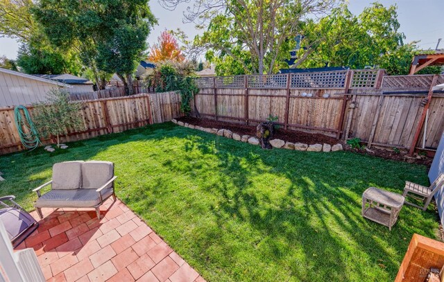 view of yard featuring stairway and a fenced backyard