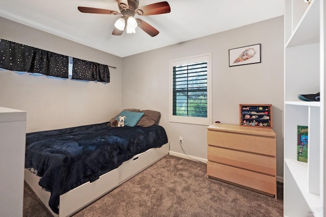 bedroom with dark carpet, baseboards, and ceiling fan