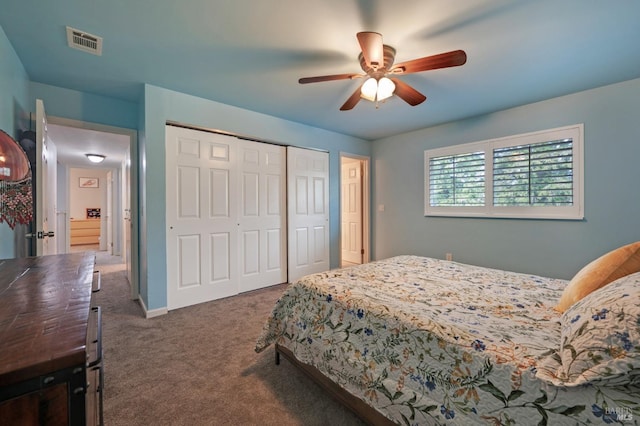 bedroom featuring a ceiling fan, carpet, visible vents, baseboards, and a closet