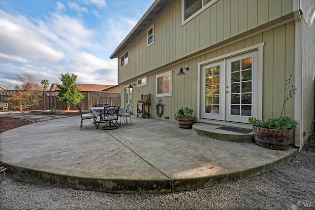 view of patio / terrace with french doors and fence