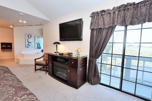 carpeted living area with lofted ceiling