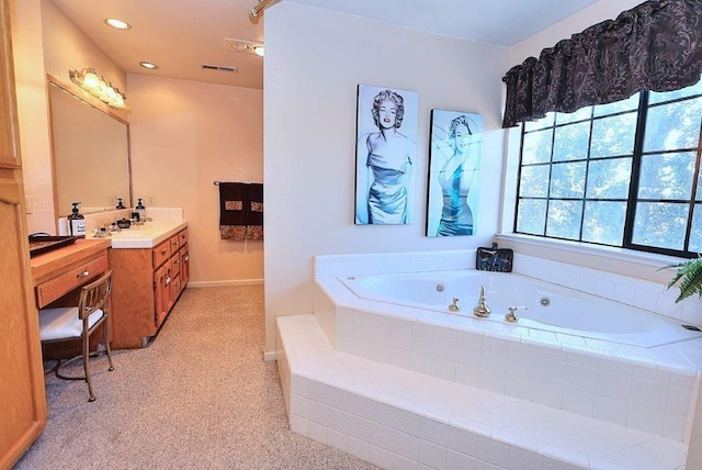 bathroom with visible vents, recessed lighting, a jetted tub, and vanity