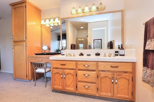 bathroom with double vanity and walk in shower