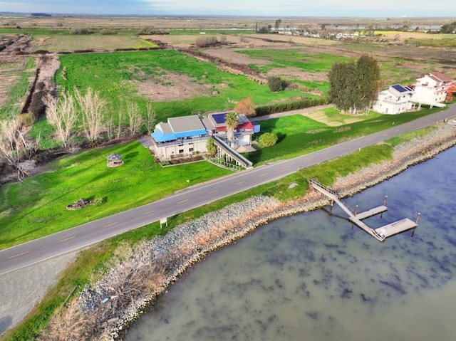 birds eye view of property featuring a rural view and a water view