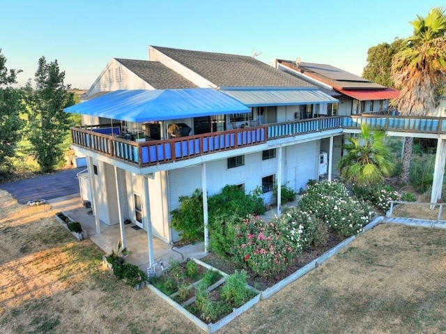 rear view of property featuring a patio