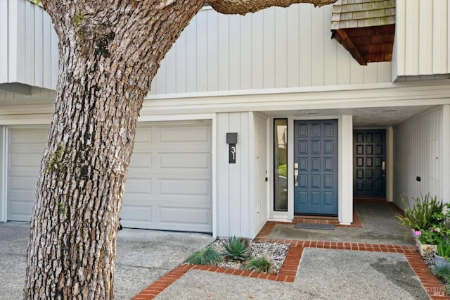 doorway to property featuring an attached garage