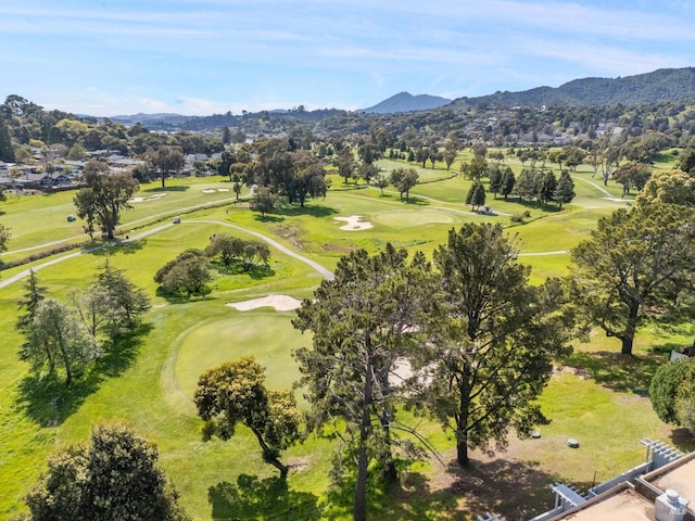 aerial view featuring a mountain view and view of golf course