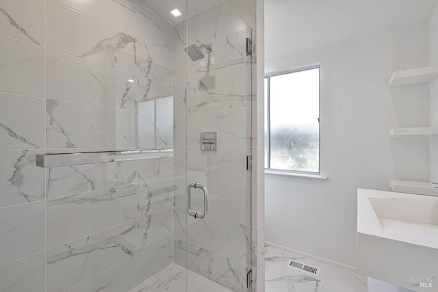 bathroom with visible vents, a stall shower, and marble finish floor