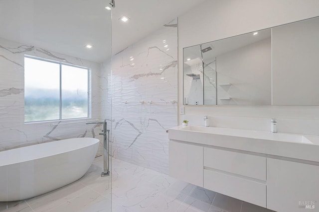 bathroom with a freestanding tub, marble finish floor, recessed lighting, a marble finish shower, and double vanity