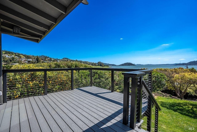 wooden deck featuring a water view